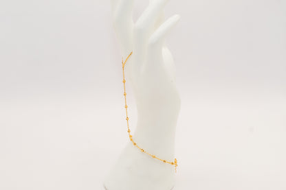 21k gold beaded hand bracelet