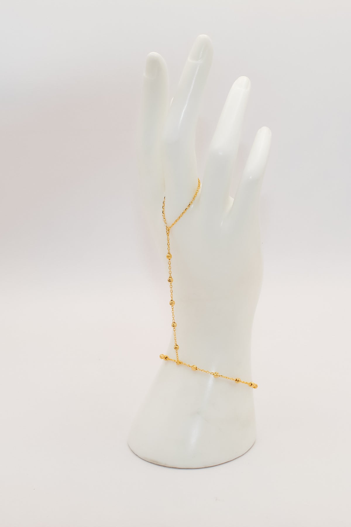 21k gold beaded hand bracelet