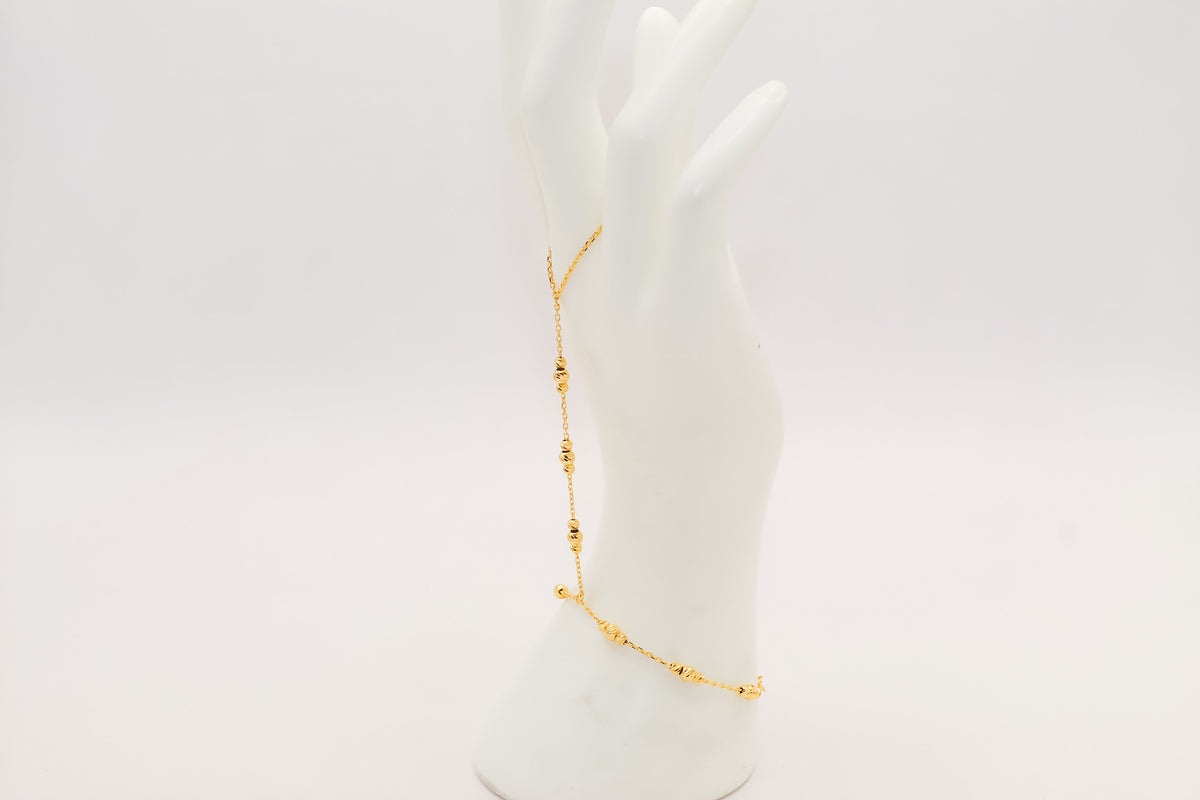21k gold beaded hand bracelet